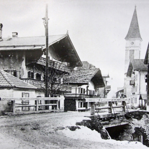 1916, Brücke über den Wörgler Bach, GH Aufinger davor Hl. Nepomuk und Waltl-Metzger, Bäckerei Mitterer, Gasthof Alte Post, Mangbauer, Kirchturm, Gasthof Volland, Franz Danek